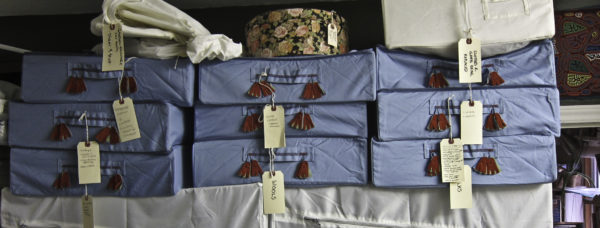 Image of part of the stash stored in blue zip-up IKEA containers with red tassels